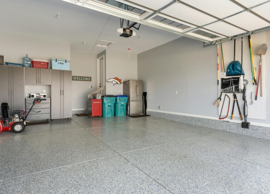 Garage Tex Multi-color Flake and High Gloss Epoxy Floor Coating Image of aGarage Tex Completed Project with gray coating, multi-colored flake and high gloss finished.